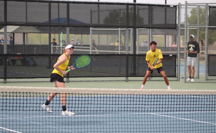 Seminole’s Addison Armstrong (left) and Tristan Hare wait for a serve during a mixed doubles match against Andrews at the District 3-4A Championships on Wednesday at the Bush Tennis Center in Midland. (LEE SCHEIDE| SEMINOLE SENTINEL)