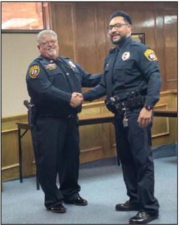 With great pride, Officer Joey Holguin accepted his welldeserved promotion to the rank of Sergeant. The solemn ceremony wasmadeevenmorespecialwhenhiswifeanddaughter had the honor of pinning the insignia upon his uniform. (Sentinel photo/Jessenia Balderas)