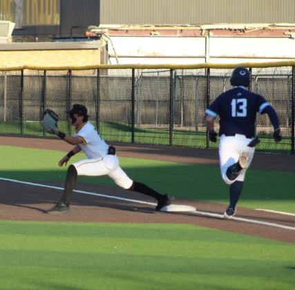Seminole first baseman Eloy Macias makes the putout of Greenwood’s Zac Rybolt (13) during a District 3-4A game on Friday at Seminole. (LEE SCHEIDE|SEMINOLE SENTINEL)