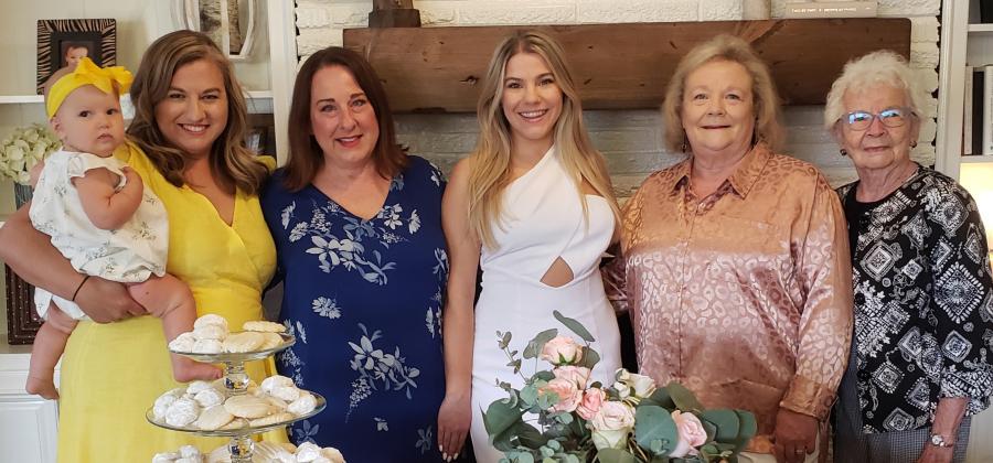 Miss Kelsie Foster, bride-elect of Reed Chappell was honored with a bridal shower Sat., June 3rd. Pictured left to right are Kelsey Chappell, holding Bainx Chappell, sister-in-law and niece of the groom; Melissa Foster, mother of the honoree; Kelsie Foster, honoree; Christie Chappell, mother of the groom and Francys Cauble, grandmother of the groom. (Contributed photo).