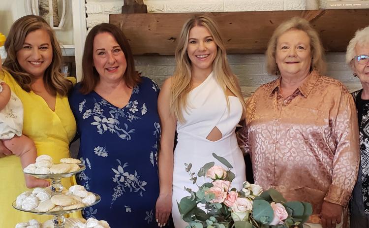 Miss Kelsie Foster, bride-elect of Reed Chappell was honored with a bridal shower Sat., June 3rd. Pictured left to right are Kelsey Chappell, holding Bainx Chappell, sister-in-law and niece of the groom; Melissa Foster, mother of the honoree; Kelsie Foster, honoree; Christie Chappell, mother of the groom and Francys Cauble, grandmother of the groom. (Contributed photo).